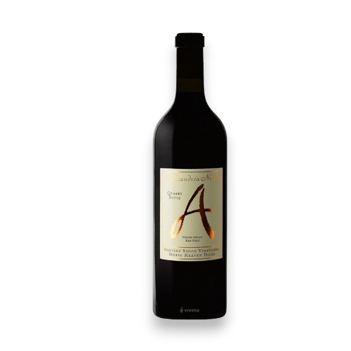The ALEXANDRIA NICOLE 'QUARRY BUTTE' CABERNET BLEND 2021 from Columbia Valley features a label with a large, stylized "A" and text below. Its dark neck and maroon cork contrast beautifully against the plain white background. Brand: WINE: AMERICAN PREMIUM BEVERAGE.