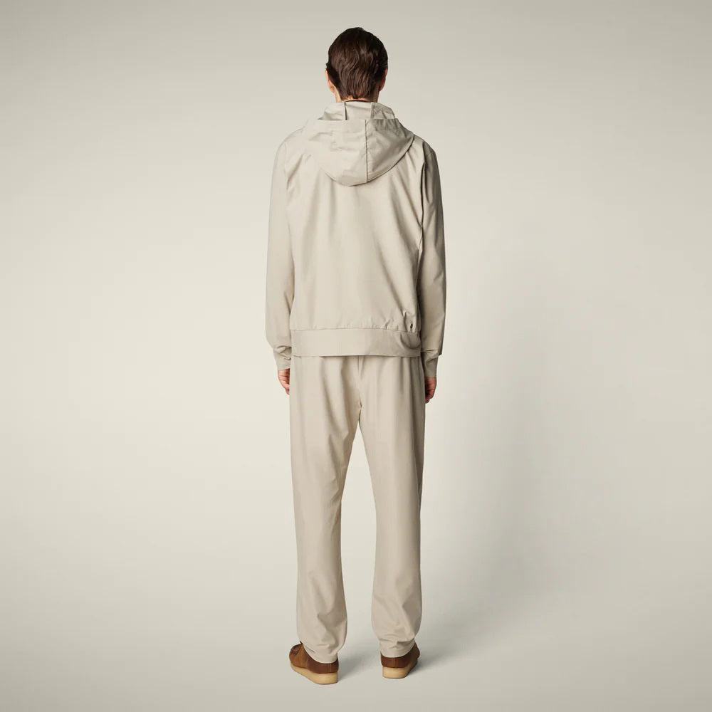 SAVE THE DUCK - MICHAEL MEN'S TECH TROUSERS: Beige straight-leg men’s pants from SAVE THE DUCK, featuring an elastic waistband and crease-resistant stretch fabric, shown on a plain light background.