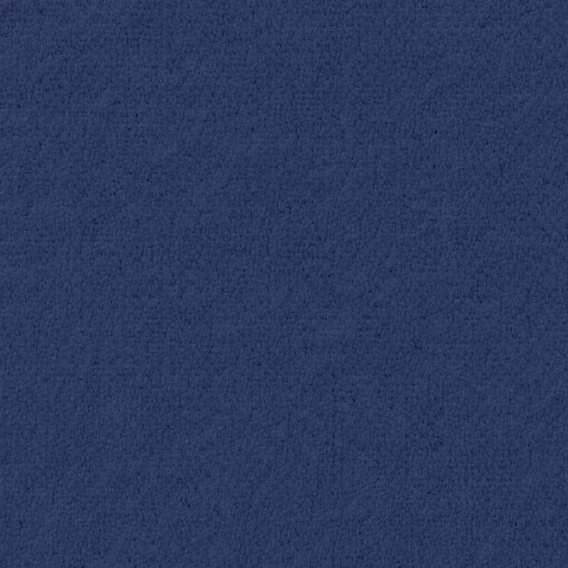 A woman wearing a SOFTIES - RUFFLE CHENILLE ROBE 36″ IN MIDNIGHT, a knee-length navy blue chenille robe with cascading ruffle trim.