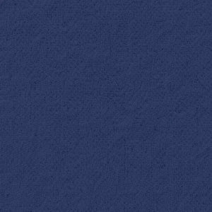 A woman wearing a SOFTIES - RUFFLE CHENILLE ROBE 36″ IN MIDNIGHT, a knee-length navy blue chenille robe with cascading ruffle trim.