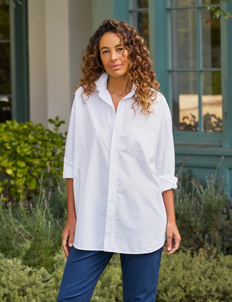 The FRANK AND EILEEN - SHIRLEY OVERSIZED BUTTON UP SHIRT features rolled long sleeves, a classic collar, a chest pocket, and an oversized fit. Made from 100% cotton poplin in classic white, the label inside is partially visible, making it ideal for casual wear.