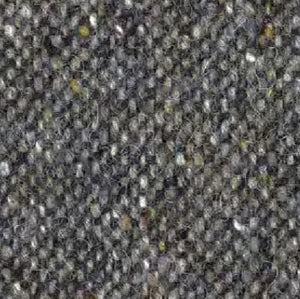 Close-up of the WIGENS Ivy Contemporary Donegal Tweed Cap in dark grey melange, featuring a textured woven fabric with small, tightly packed loops, accented by flecks of white and yellow—evoking the classic Donegal Tweed flat cap style.