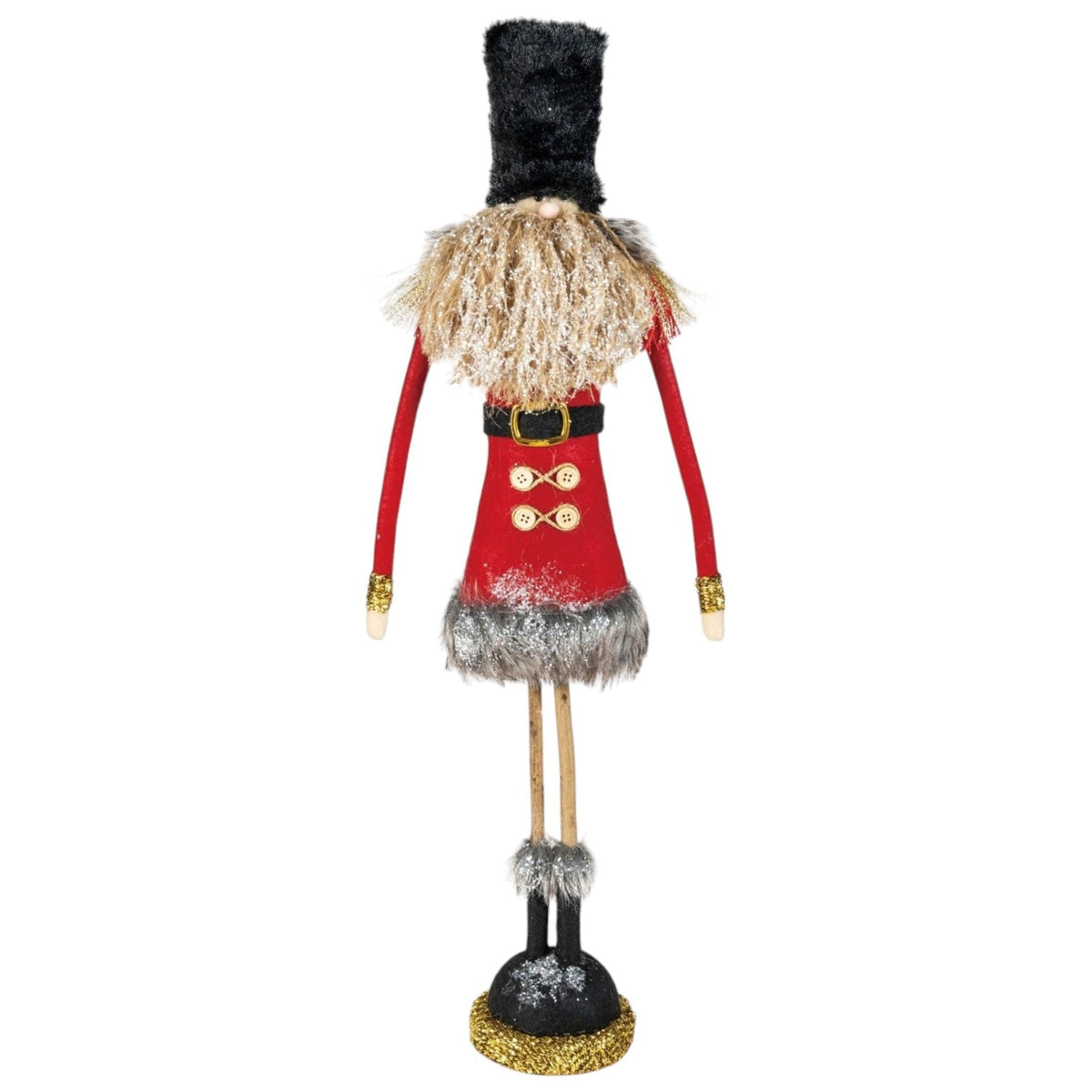 Two decorated gold tinsel Christmas trees stand next to two FABRIC SOLDIER WITH GLITTER, FAUX FUR AND TWIG LEGS figurines.