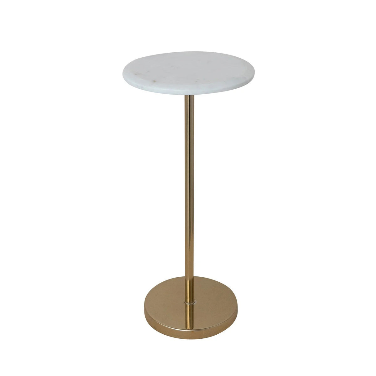A green patterned armchair with a yellow throw is beside the CREATIVE COOP MARBLE TOP GOLD MARTINI TABLE. The table has a white marble top and seahorse-shaped gold pedestal base, supporting a vase and bowl; framed artwork decorates the white wall behind.