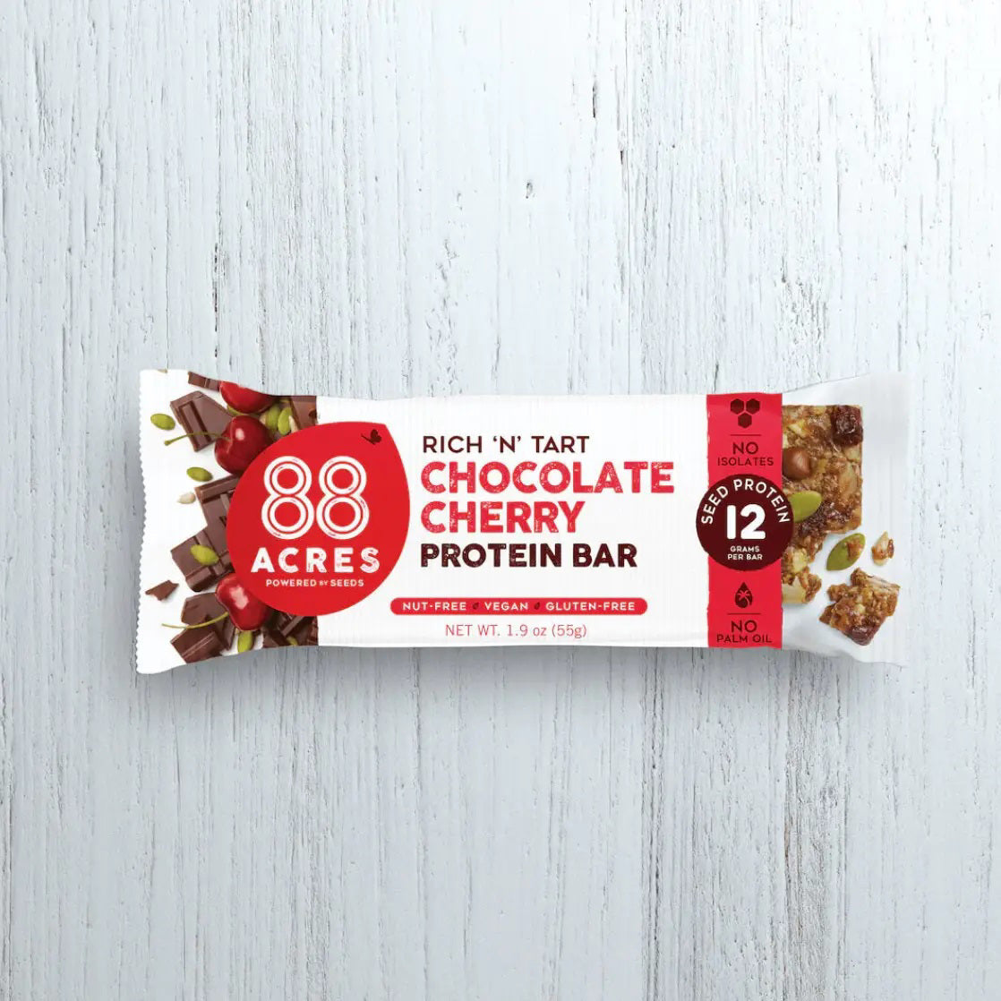 An image showing the nutrition facts and ingredients of the 88 ACRES - CHOCOLATE CHERRY PROTEIN BAR, with 270 calories per serving. Main ingredients include dark chocolate, pumpkin seeds, cherries, sunflower seeds, and maple syrup.