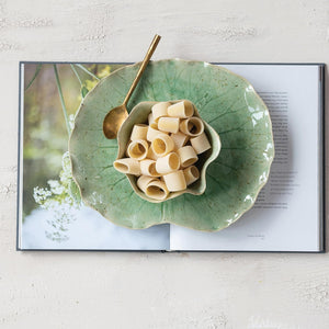 The CREATIVE COOP STONEWARE WATER LILY PLATE WITH BOWL features a green lotus leaf shape and reactive crackle glaze, displayed together against a plain gray background.
