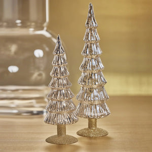 Two 3.5 in x 10.75 in silver-toned mercury glass MIRAMONTI FLASS TREE ON GOLD GLITTER BASE - 10.75″ decorations with gold glitter bases standing on a surface.