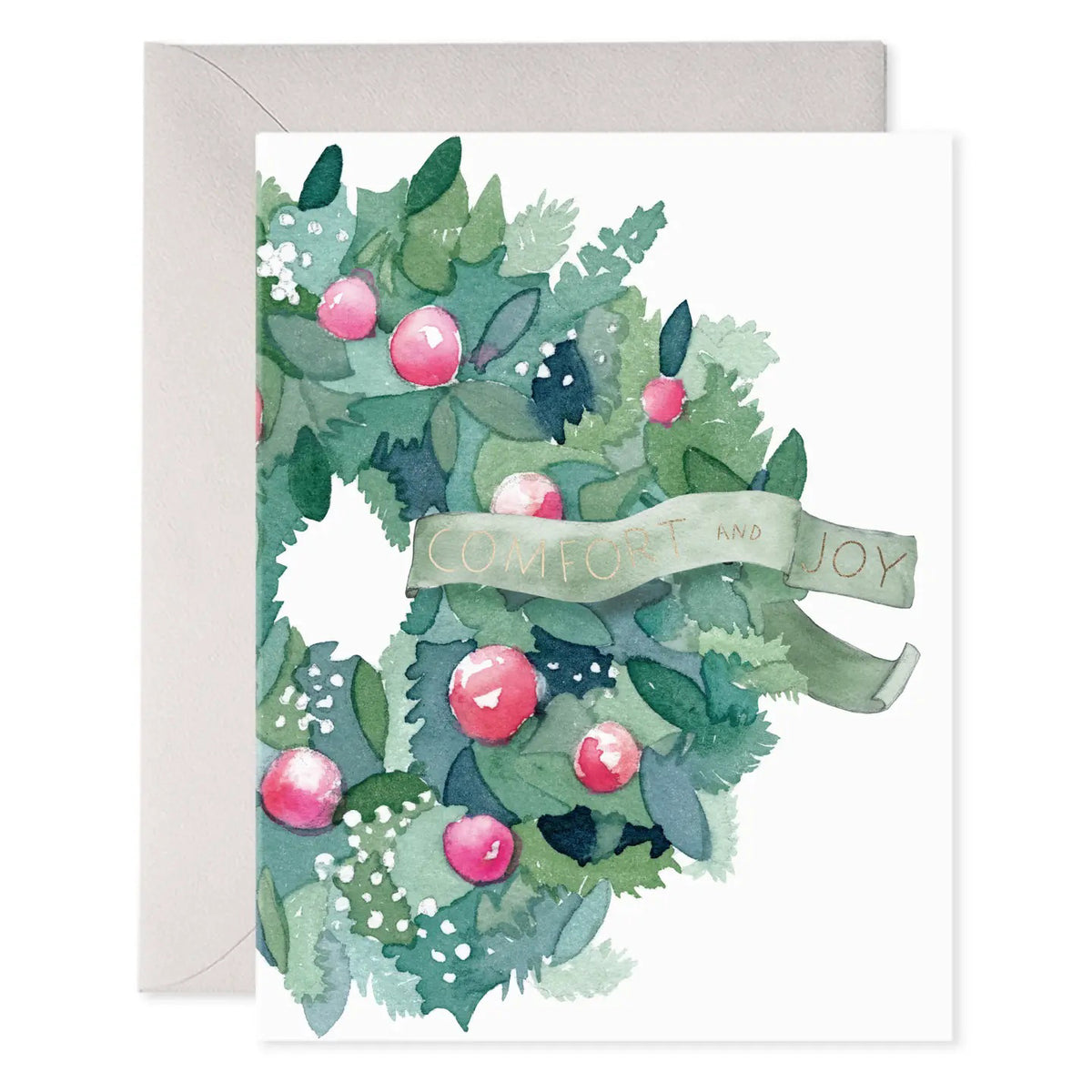 The E. FRANCES - COMFORT AND JOY WREATH CARD by E. FRANCES PAPER features a watercolor wreath of green leaves, red berries, and white accents with a &quot;Comfort and Joy&quot; ribbon. Printed on heavyweight paper with a light gray envelope. Made in the USA.