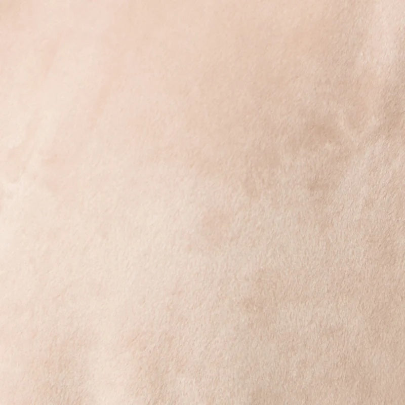 A person wearing a beige SOFTIES - SERENITY WRAP ROBE featuring a wrap silhouette with a tie waist and side pockets.