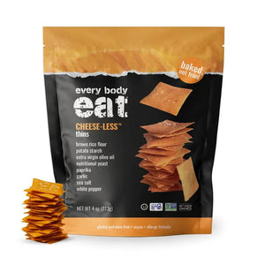 A bag of EVERY BODY EAT - CHEESE-LESS SNACK THINS, showing a stack of square crackers on the front. The packaging emphasizes that these gluten-free thins are baked—not fried—and displays ingredients and dietary features at the bottom, making them an ideal allergy-friendly snack option.