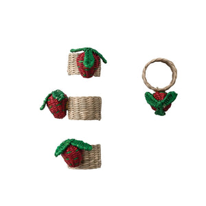 The CREATIVE COOP HAND-WOVEN SEAGRASS STRAWBERRY NAPKIN RINGS, SET OF 4, feature red and green strawberry accents and are displayed on a white background.