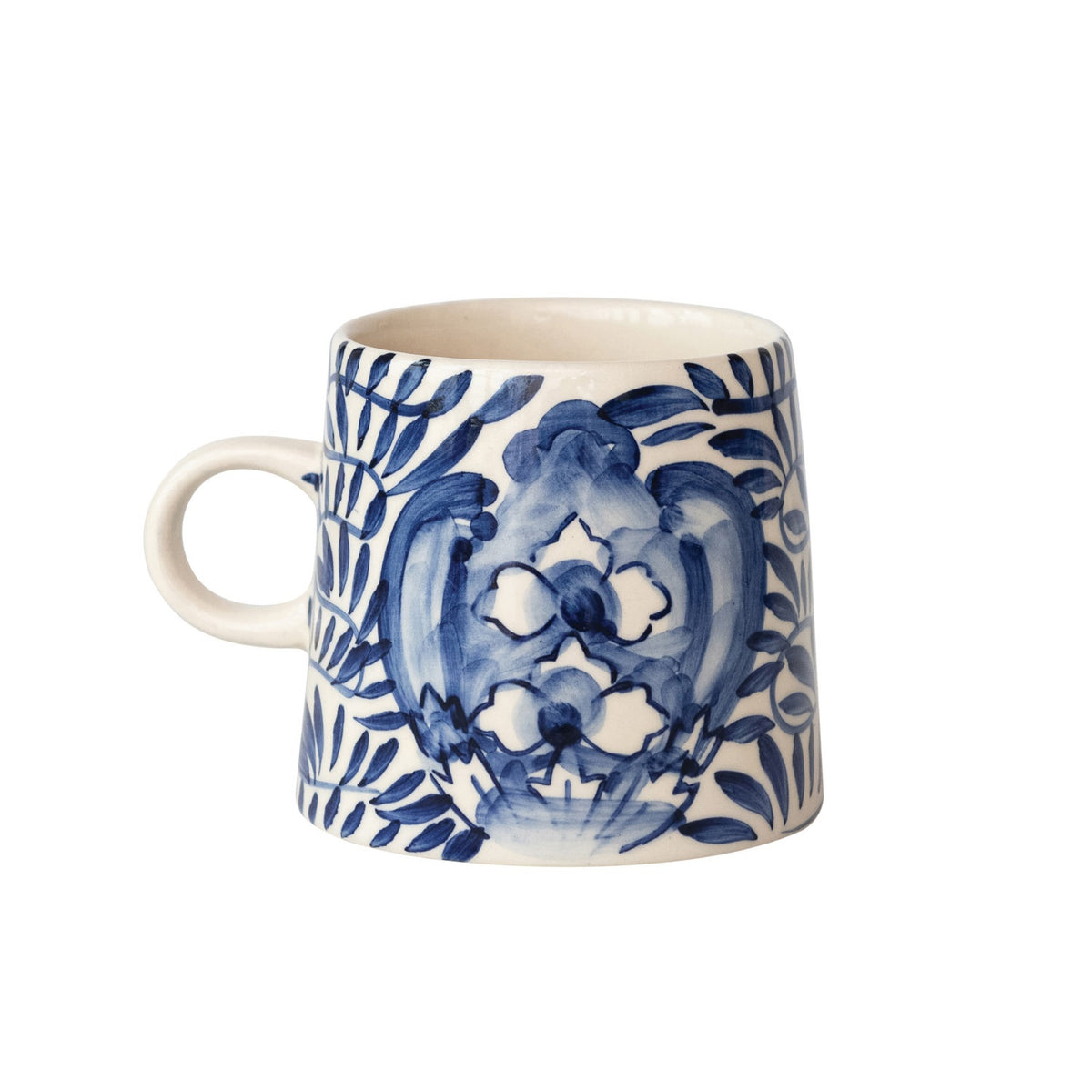 The CREATIVE COOP CREAM AND BLUE HAND-PAINTED STONEWARE MUG features a blue floral and leaf design on white, a handle, tapered shape, and glossy finish—bringing artisanal charm to your daily coffee.