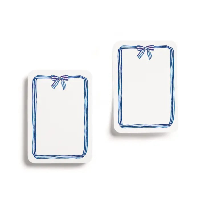 A pack of E. FRANCES PAPER "LITTLE STICKIES BLUE RIBBON" watercolor sticky notes featuring a blue ribbon border, displayed on green and dark blue striped packaging.