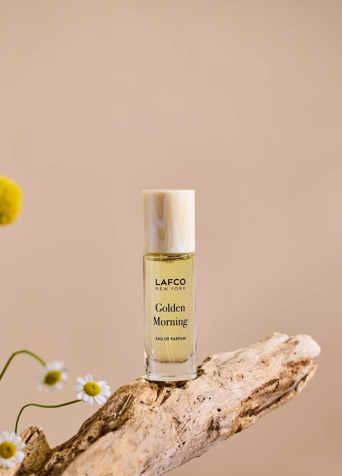 Housed in a clear glass bottle with a beige cap and minimalist black labeling, LAFCO Fine Fragrance Golden Morning 10ml is a floral perfume delicately crafted with essential oils for a fresh, uplifting scent.