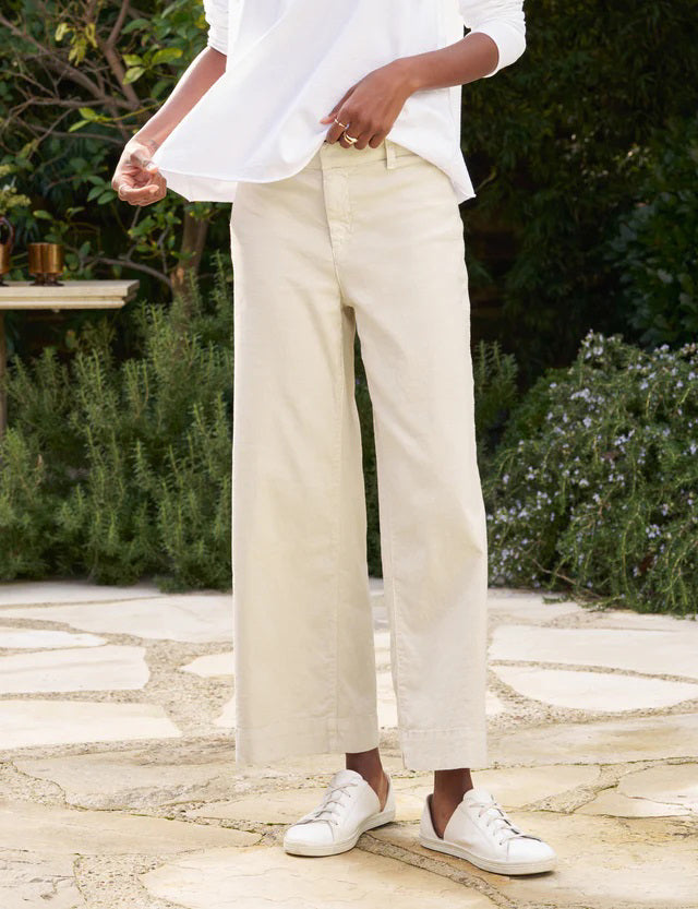 The FRANK &amp; EILEEN Wexford Wide Leg Linen Pants in Cement are showcased against a light textured background. These Italian Performance Linen pants feature a fitted waist with belt loops and a zip fly with button closure. The bottom hems are neatly finished, providing a clean, tailored appearance.