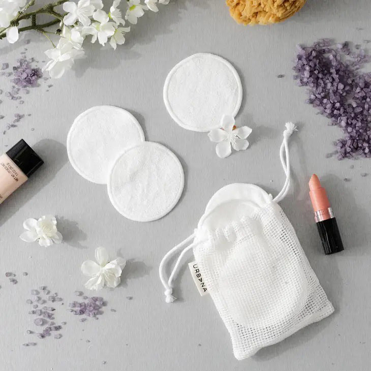 A set of REUSABLE FACE PADS from EUROPEAN SOAPS, LLC, perfect for your skin care routine. The image shows two white, round face pads and a white drawstring mesh bag with a tag that reads &quot;REUSABLE FACE PADS, Spa Prive.&quot; An ideal travel companion for staying refreshed on the go.