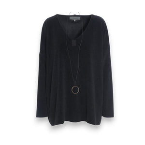 The HENRIETTE STEFFENSEN FLEECE V NECK SWEATER by HENRIETTE STEFFENSED is a loose-fitting, long-sleeve black sweater with a cozy V-neck, shown on a hanger and styled with a circular pendant necklace.