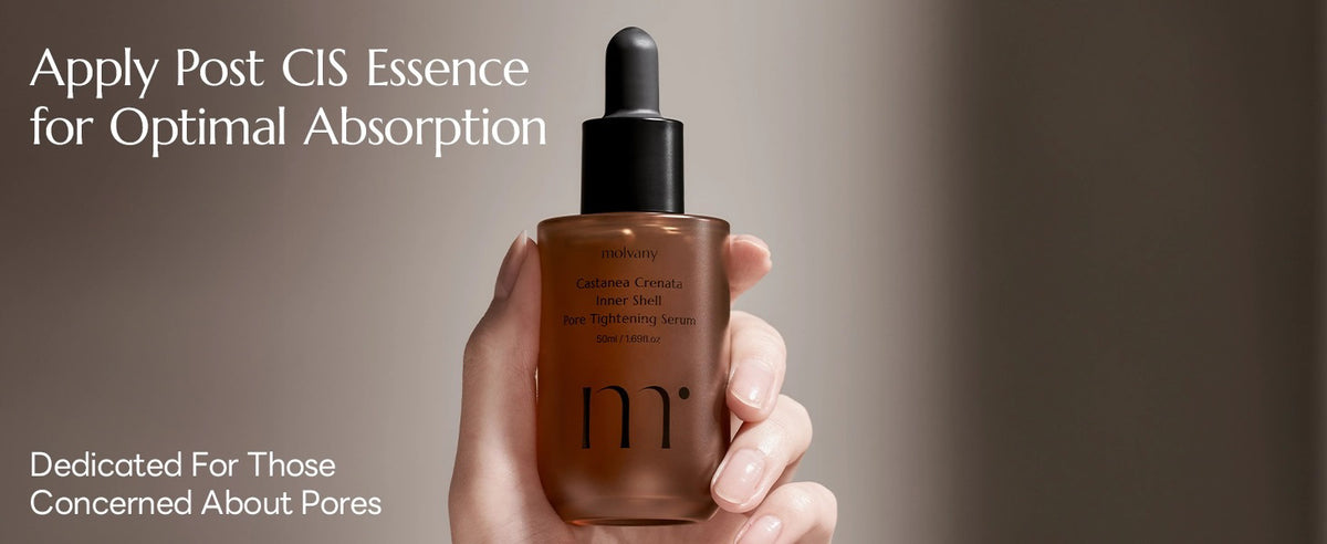 A hand holds a dropper bottle with MOLVANY - CASTANEA CRENATA INNER SHELL PORE TIGHTENING SERUM infused with Korean Yulpi extract. The label reads &quot;Apply Post CIS Essence for Optimal Absorption&quot; and is dedicated to those concerned about pores and skin hydration. Brand: HONG CHEON USA, INC.