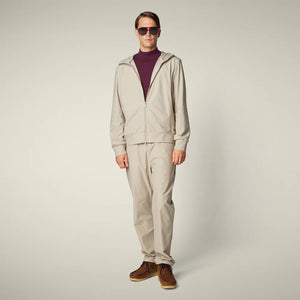 SAVE THE DUCK - MICHAEL MEN'S TECH TROUSERS: Beige straight-leg men’s pants from SAVE THE DUCK, featuring an elastic waistband and crease-resistant stretch fabric, shown on a plain light background.