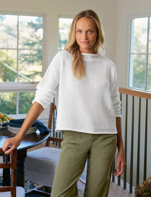 The FRANK & EILEEN Monterey Pointelle Rolled Funnel Neck Cotton Sweater in White features a relaxed fit, long sleeves, and lightweight 100% cotton Italian Pointelle fabric, shown on a plain white background.