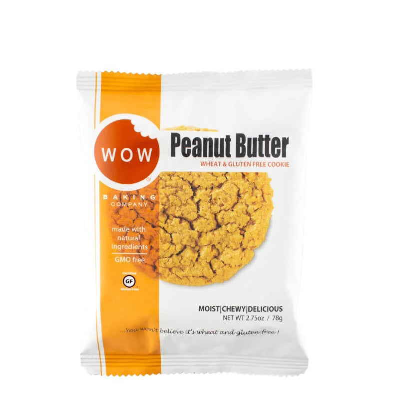 A package of WOW BAKING - GLUTEN FREE PEANUT BUTTER COOKIE from WOW BAKING COMPANY is displayed. The white and orange front features an image of a peanut butter cookie, along with text highlighting that it is wheat and gluten-free, made with natural peanut butter ingredients, non-GMO, and weighs 2.75oz (79g).