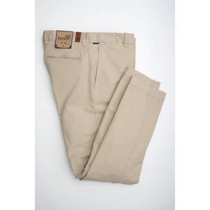 PENNBILT - THE PLAINSMAN PANT IN KHAKI by PENNBILT, featuring beige men’s stretch twill fabric and a brown patch label on the waistband, is neatly folded and displayed against a plain white background.