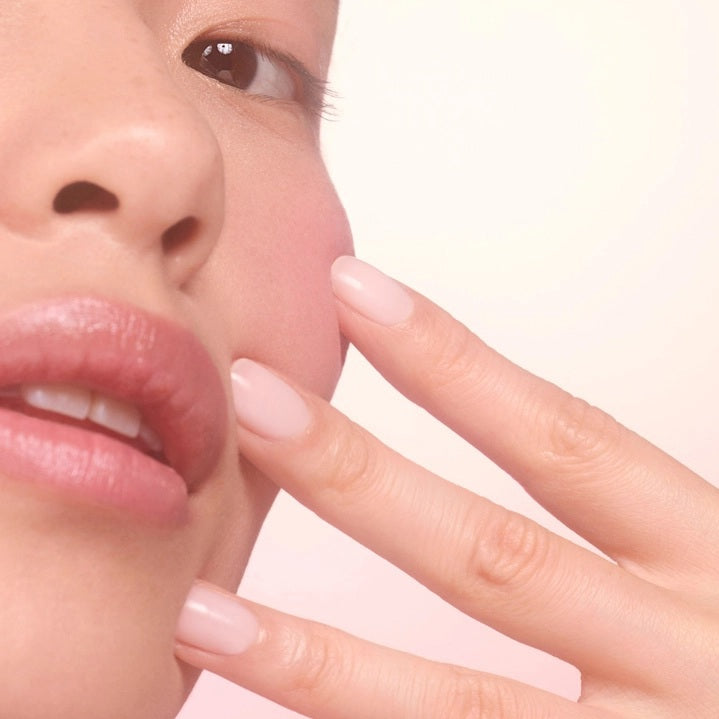 Three close-up photos of a fingernail: first, bare; second, after one coat of MANUCURIST - ACTIVE™ BLUR TREATMENT POLISH in a powder-pink shade (appearing slightly shinier); and third, after two coats (showing even glossier and smoother results). Each stage is clearly labeled to highlight the transformation, perfect for fans of MANUCURIST INC vegan nail care solutions.