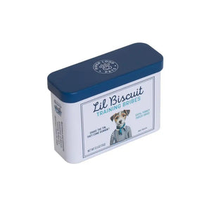 A rectangular tin with a blue lid labeled “PIPER LOOP PETS - LIL BISCUIT TRAINING BRIBES, FREEZE-DRIED TURKEY” features a puppy photo and contains 100% turkey, protein-rich treats for training and emergency recall.