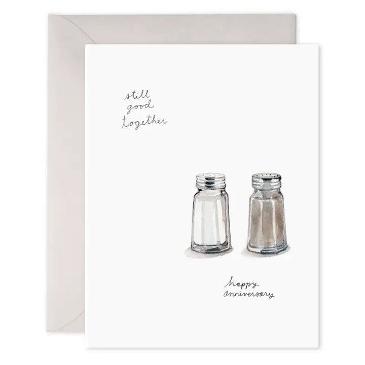 The E. FRANCES - SALT N PEPA ANNIVERSARY CARD by E. FRANCES PAPER features watercolor salt and pepper shakers with "still good together" and "happy anniversary" on heavyweight paper, visible envelope included, made in the USA.