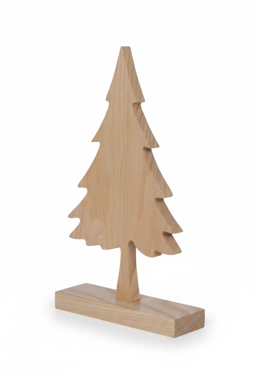 Six ASH WOOD SILHOUETTE TREE ON BASE 10″ light ash wood tree silhouettes on rectangular bases arranged with scattered pinecones.