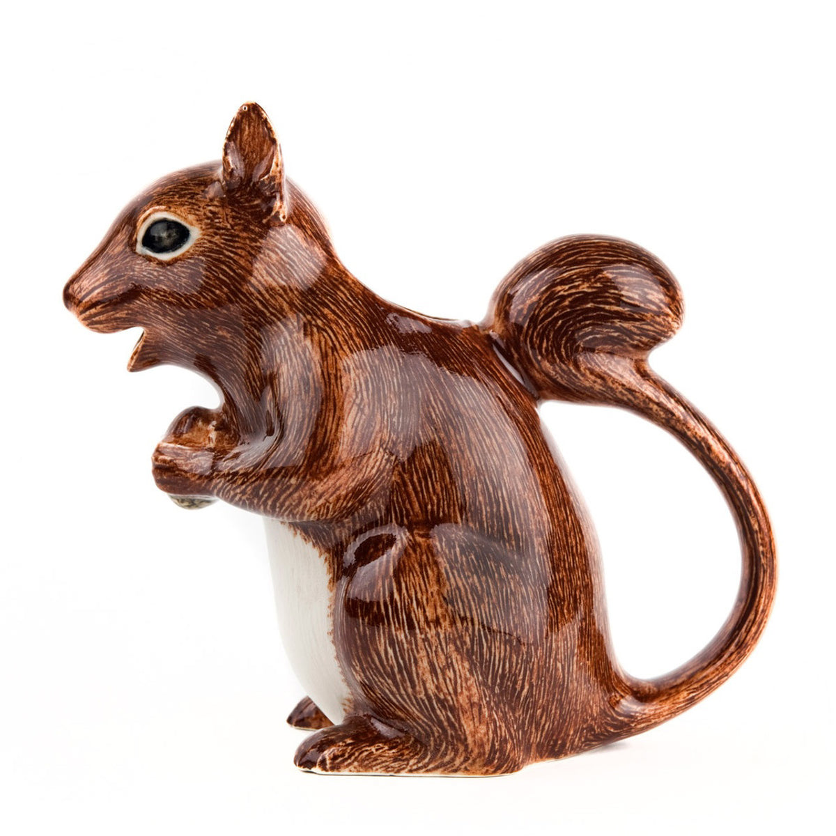 The QUAIL CERAMICS - SQUIRREL JUG by QUAIL DESIGNS is a hand-painted stoneware figurine depicting a brown squirrel with a white belly, standing upright and holding its paws together against a plain white background.