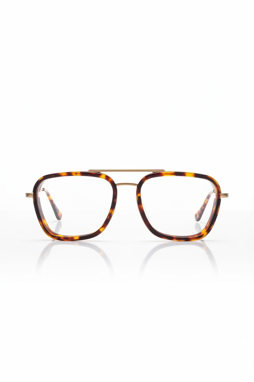 CADDIS - STANTON Progressive Readers in Turtle feature tortoiseshell square eyeglasses with a minimalist metal frame and gold bridge and temples. Displayed on a white background facing forward, these eyeglasses from CADDIS are equipped with scratch-resistant lenses for durability and lasting clarity.