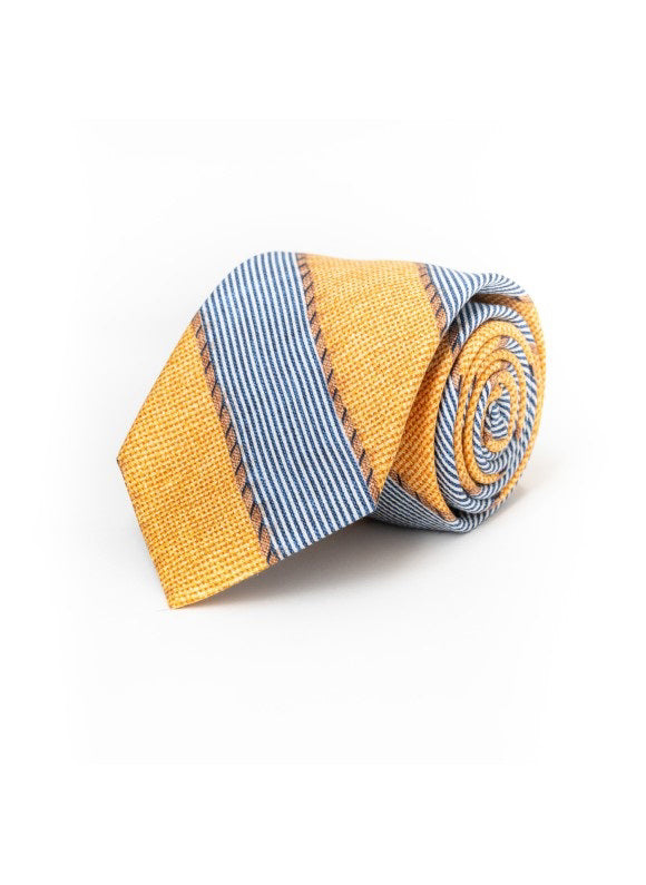 The EDWARD ARMAH - FANCY YELLOW STRIPE SILK TIE by EDWARD ARMAH displays diagonal blue and white stripes alternating with textured yellow stripes on a white background.