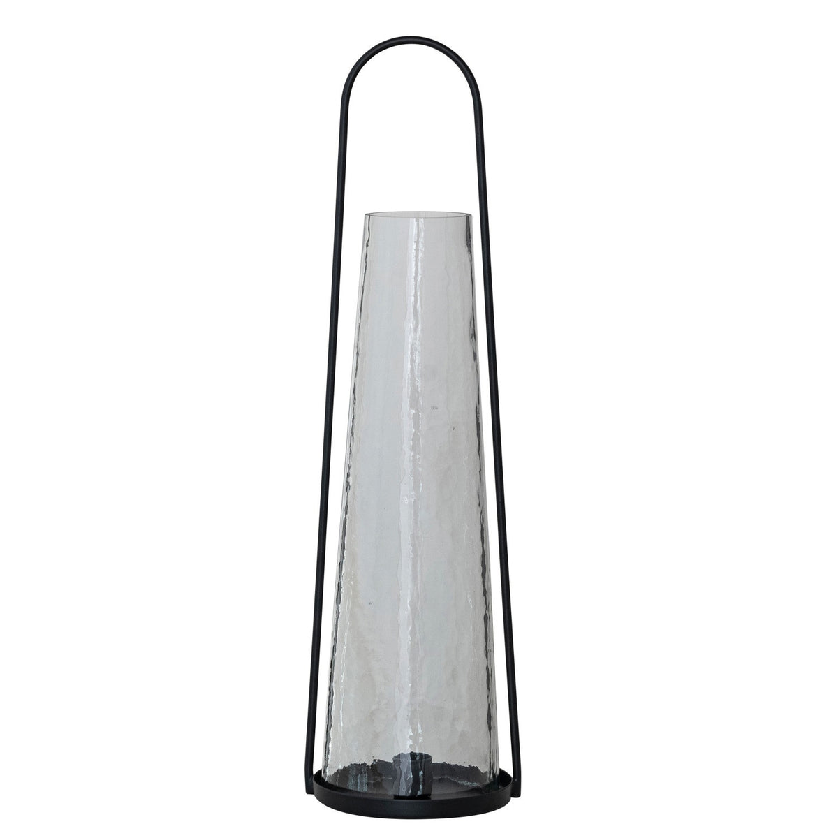 The ROUND METAL LANTERN TAPER HOLDER WITH HAMMERED GLASS HURRICANE by CREATIVE COOP features a tall, black metal frame and a cone-shaped hammered glass hurricane for a modern, minimalist look with sleek lines and transparent materials.