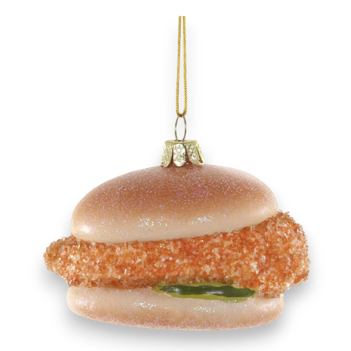 The SOUTHERN STYLE CHICKEN ORNAMENT by CODY FOSTER features a fried chicken sandwich design—bun, crispy patty, and pickle—hanging by a gold string. Perfect for collectors and design lovers to add a quirky touch to any tree.