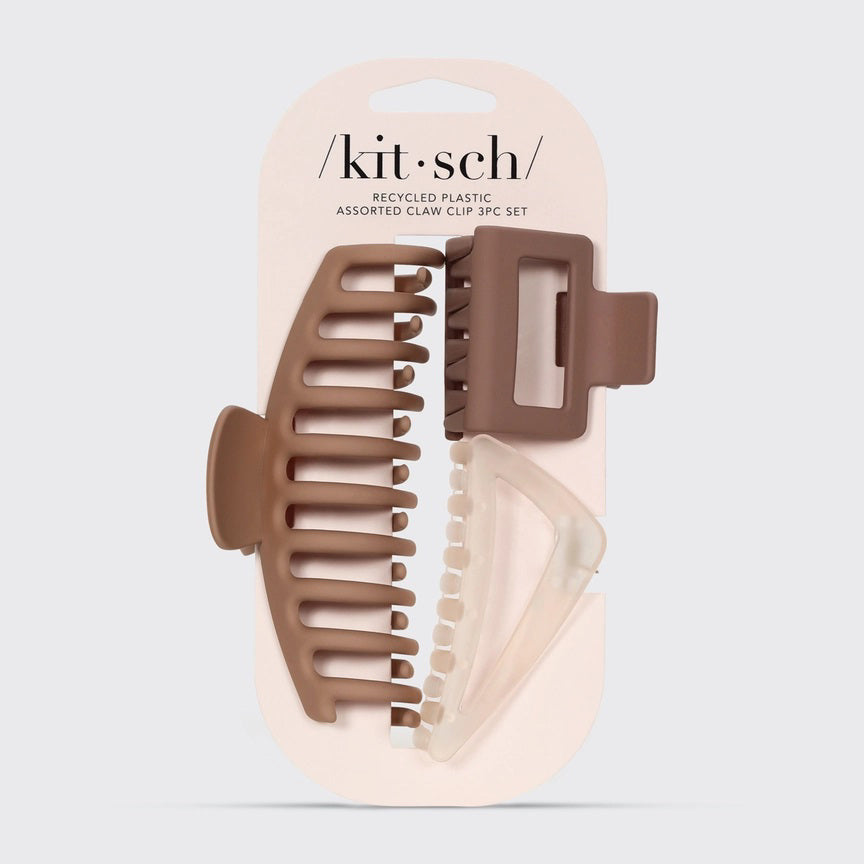 The KITSCH - RECYCLED ASSORTED CLAW CLIPS set features three eco-friendly clips crafted from recycled plastic, in various sizes and brown/clear shades, beautifully displayed on a beige backing card.
