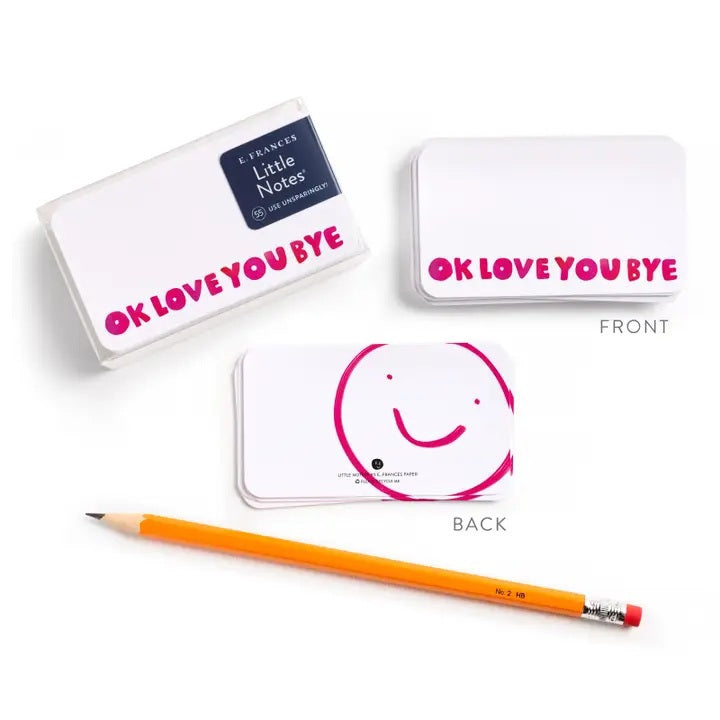 The E. FRANCES PAPER "LITTLE NOTES OKLOVEYOUBYE" set includes white mini cards with "OK LOVE YOU BYE" in pink, a smiley face on the back, and a yellow pencil—perfect for sharing heartfelt notes.