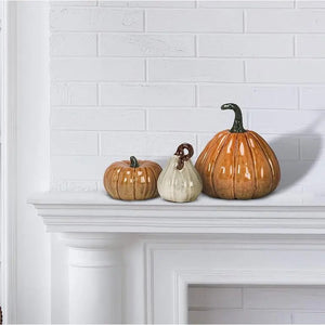 MEDIUM CERAMIC PUMPKIN in glossy tan glazed ceramic with a dark green stem, perfect for fall decor.