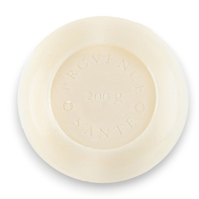 A hexagonal blue box of Baudelaire Jasmine 7 oz Boxed Bath Bar, enriched with shea butter. The box features a large, stylized white flower design and text such as &quot;Jasmine,&quot; &quot;Savor artisanaux,&quot; &quot;Artisan Soap,&quot; and &quot;Made in France.