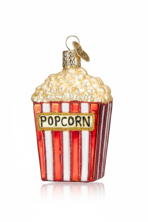 Old World Christmas POPCORN ORNAMENT glass ornament shaped like a red and white striped popcorn snack bucket with the word “POPCORN” printed on the front.