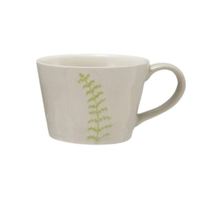 Four DEBOSSED STONEWARE MUGS WITH BOTANICAL PATTERN by CREATIVE COOP, featuring cream color, unique green botanical designs, and a subtle reactive glaze finish, are lined up side by side on a white background.
