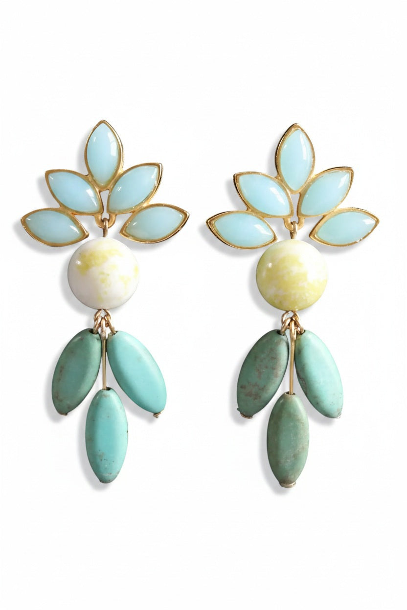 The DAVID AUBREY Vintage Glass and Turquoise Earrings showcase decorative marquise glass with gold and light blue leaf shapes, a central round white-and-yellow bead, and three elongated turquoise beads that dangle below.