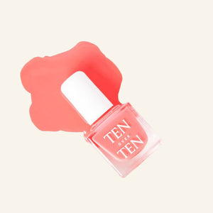 A glass bottle of TENOVERTEN - NAIL POLISH from the brand TEN OVER TEN, featuring a white cap and a dusty pink nail color. The front label displays "TEN OVER TEN" in white uppercase letters. This vegan, eight-free formula ensures both beauty and peace of mind. The background is plain and light-colored.
