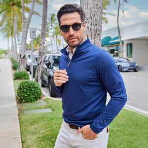 Close-up of COLLARS AND CO's PALM PIMA BLEND QUARTER ZIP IN NAVY, featuring dark blue fabric with a soft, textured surface and subtle sheen—perfect for lightweight layering and modern comfort.