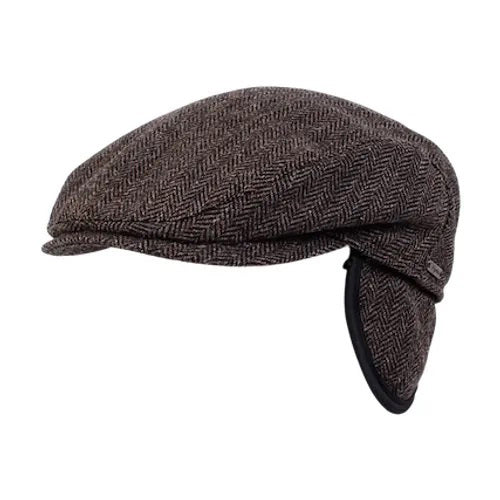 The WIGENS IVY SLIMP HERRINGBONE CAP is a dark gray Shetland wool flat cap with ear flaps, shown in side view on a white background.