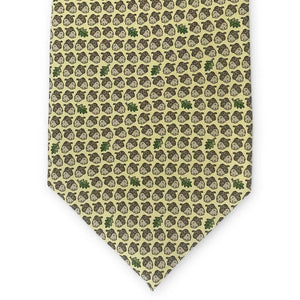 The PETER-BLAIR - ACORNS SILK TIE IN YELLOW by BIRD DOG BAY is a handmade yellow necktie from New York, adorned with a repeating pattern of brown acorns and occasional green oak leaves.