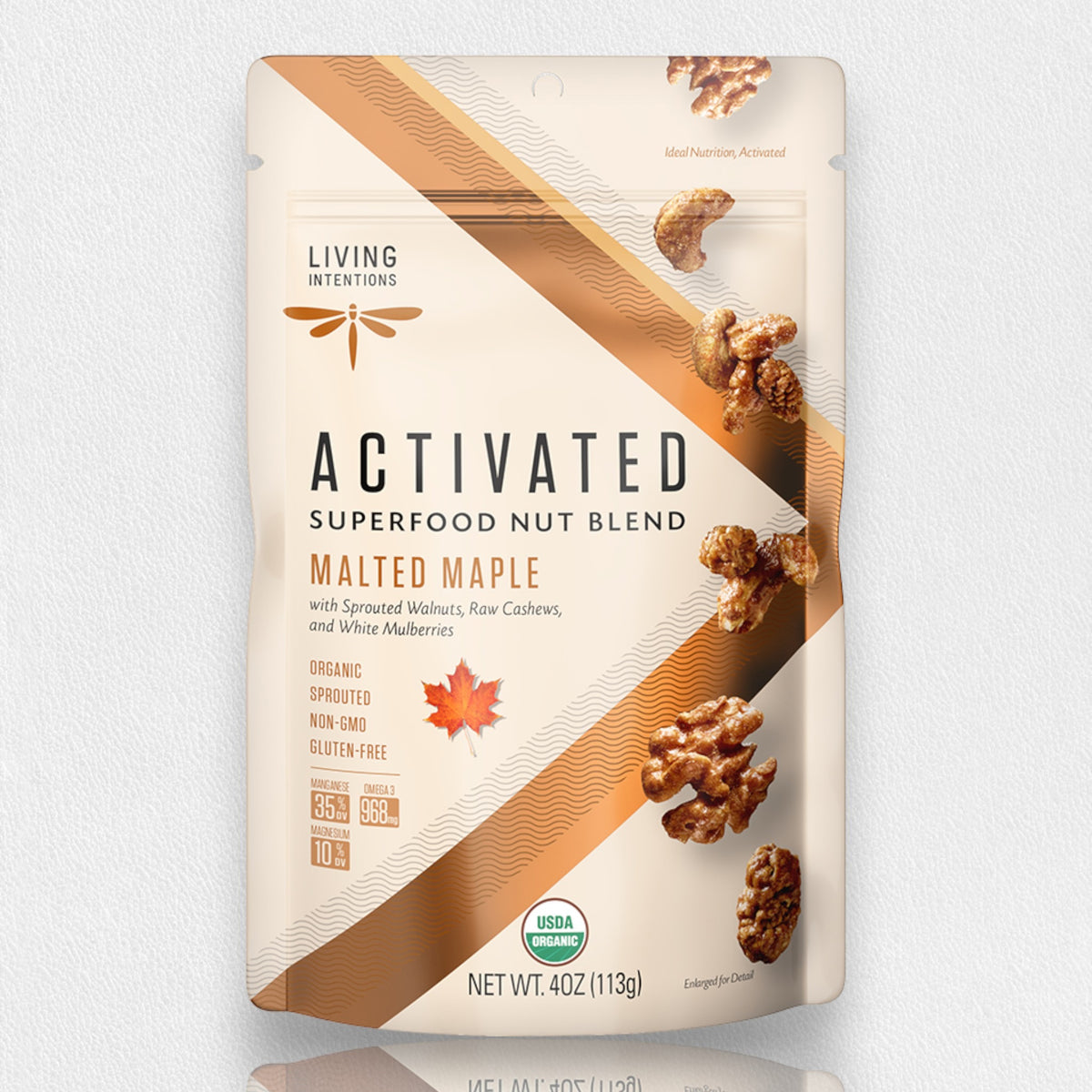 A pouch of LIVING INTENTIONS - MALTED MAPLE NUT BLEND SUPERFOOD containing a blend of sprouted walnuts, cashews, and white mulberries.