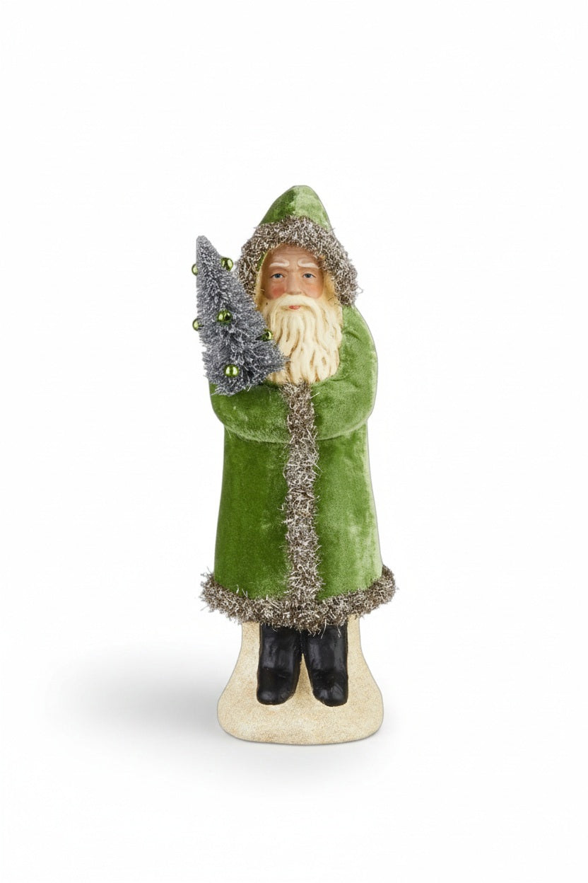 The OLD WORLD GREEN VELVET SANTA 12" by RAZ IMPORTS features Santa in a green velvet coat and hat with tinsel, holding a decorated tree on a beige base—an ideal festive accent for your home.