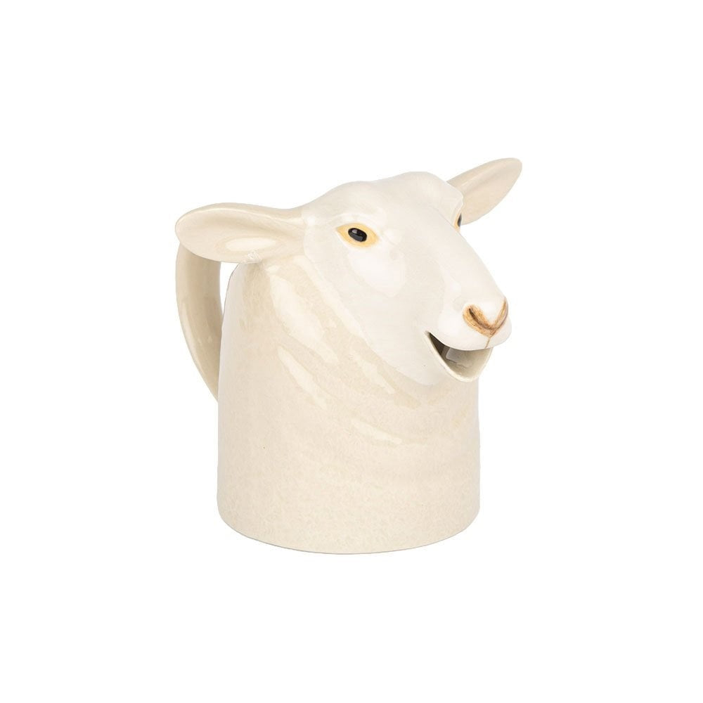 The QUAIL CERAMICS - WHITE SUFFOLK SHEEP JUG by QUAIL DESIGNS is a sheep-shaped ceramic jug, off-white with painted details, featuring a handle and top opening—ideal for adding farmhouse charm to your kitchen.