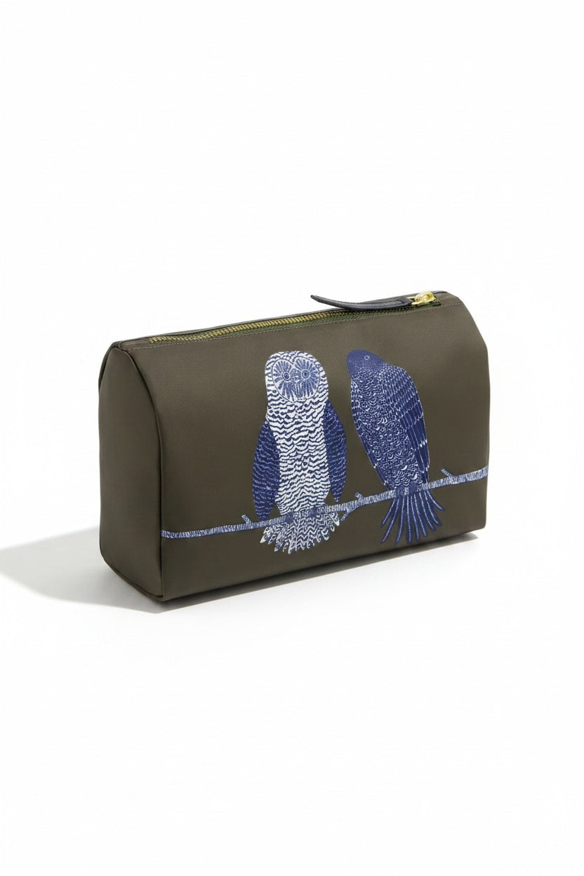 The INOUI EDITIONS - CHOUETTE COSMETIC POUCH IN KHAKI by INOUI is a khaki polyester pouch featuring embroidered designs of three blue owls and one blue cat sitting together on a branch, crafted in India.